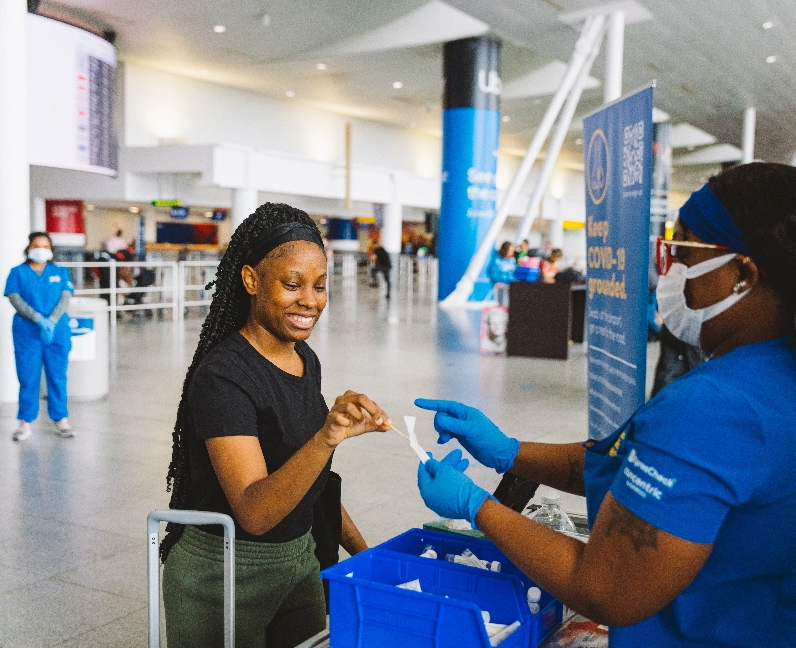 passenger and nurse at health station in airport